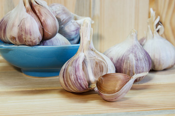 Garlic. Garlic Cloves and Garlic Bulb on a wooden background. Organic garlic. Country style . Selective focus. Close-up.