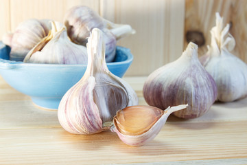 Garlic. Garlic Cloves and Garlic Bulb on a wooden background. Organic garlic. Country style . Selective focus. Close-up.