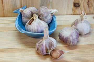 Garlic. Garlic Cloves and Garlic Bulb on a wooden background. Organic garlic. Country style . Selective focus. Top view. Close-up.