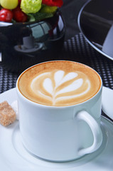 White cup of hot coffee latte