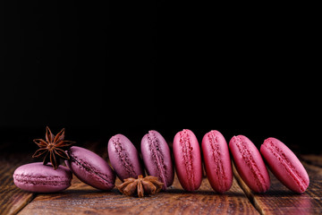 Macaroons on a wooden background.