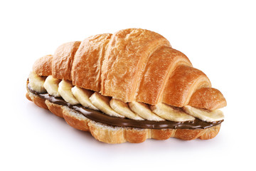Croissant with chocolate butter and banana isolated on white background.