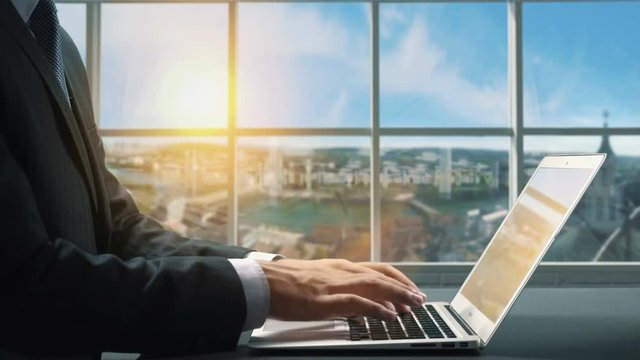 View of Solothurn Switzerland.Close up hand Businessman using laptop