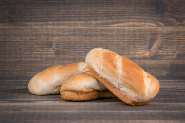 fresh light bread on a wood, food background