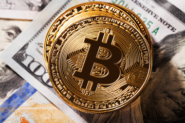 golden bitcoin on money bills background
