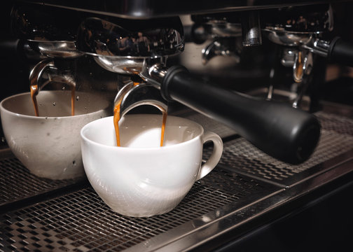 Process of preparing cappuccino in a professional coffee machine