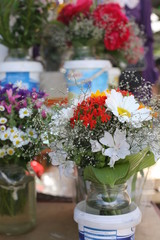 Local Farmers Market. Fresh produce: vegetables, berries, wild flowers. Older people buying groceries. Lithuania.