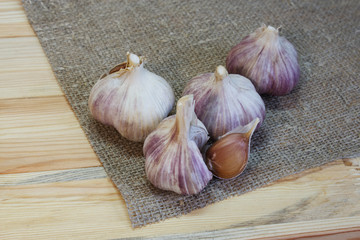 Garlic. Garlic Cloves and Garlic Bulb on vintage burlap. Organic garlic. Place for text, copy space Concept of healthy food.  Selective focus.
