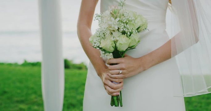 Beautiful bride with flower bouquet on wedding day