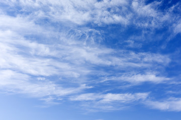 Blue Sky background with Clouds at the bottom of the sky.
