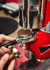 The process of grinding coffee beans for espresso