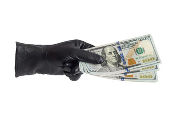 An isolated hand in black leather gloves keeps the money on a white background. Offers money.