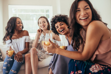 Diverse group of female friends enjoying at a party - Powered by Adobe
