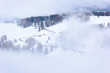 Dolomites. Winter views in the fog and low clouds
