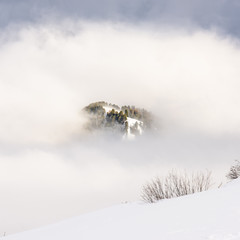 Dolomites. Winter views in the fog and low clouds