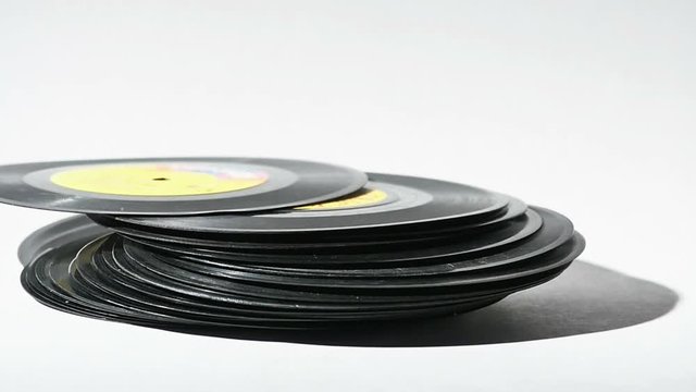 Vintage Music Records Falling Isolated on White in Slow Motion