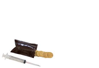 coins splash out from medicine bag and syringe on isolated white background in cost health concept