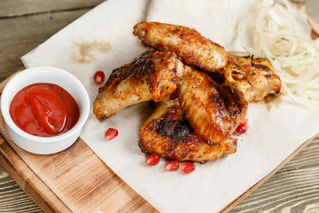 chicken wings grill. Serving on a wooden Board on a rustic table. Barbecue restaurant menu, a series of photos of different meats