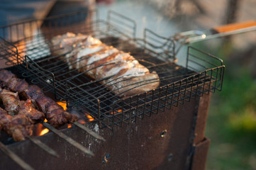 shish kebab on the grill. Marinated shashlik preparing on a barbecue grill over charcoal.