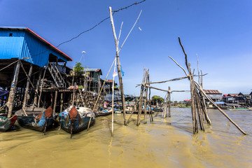Fototapeta na wymiar Siem Reap Tonle Sap Kompong Phluk under blue sky and muddy river water