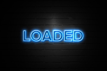 Loaded neon Sign on brickwall