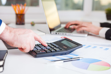 Team work process. Marketing strategy brainstorming. Paperwork and digital in office.