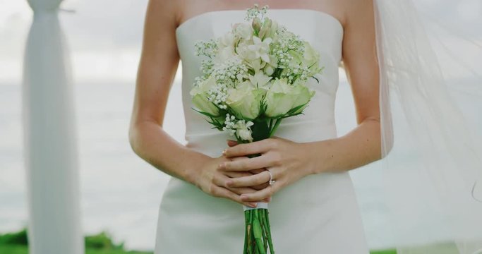 Beautiful bride with flower bouquet on wedding day