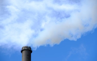 blue sky with smoking chimney