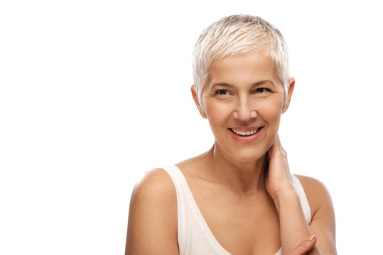 Portrait of a beautiful elderly woman, smiling, isolated on white background 