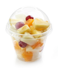 fresh fruit pieces salad in plastic cup