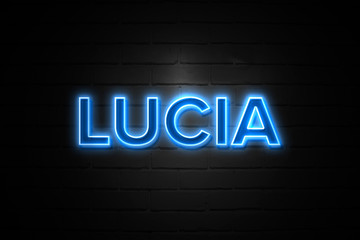 Fototapeta na wymiar Lucia neon Sign on brickwall