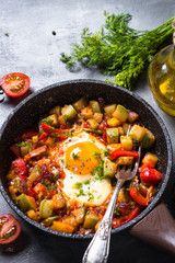 Fried egg with vegetables. 