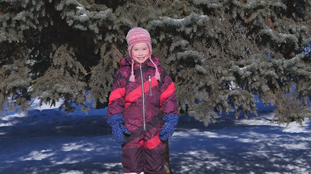 Funny kid girl on winter background
