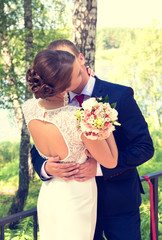 Summer romantic wedding in Provence style in the forest, on the green grass 