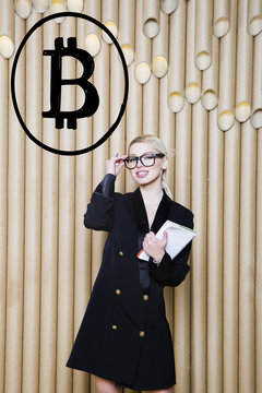 Beautiful Blond Woman Showing Standing Near Bitcoin Sketch. Virtual Money Or Btc Crush Concept. Cryptocurrency.