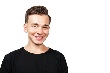 White young guy dressed in a black t-shirt on white background looking forward. Isolated.
