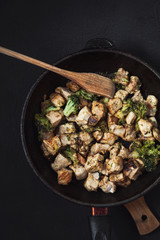 fried beef slices in a frying pan. menu restaurant recipe concept . top view