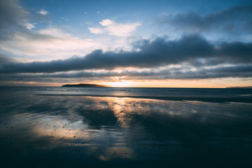 Fototapeta premium Bright sunrise on beach in Rush Ireland