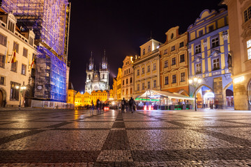 Night time illuminations of the magical Old Town Square in Prague, visible are Kinsky Palace and gothic towers of the Church