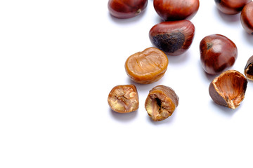Roasted chestnuts on a white background.