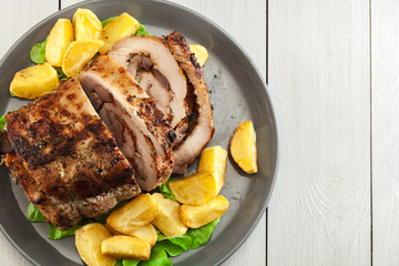 Roasted pork roll stuffed with other meat