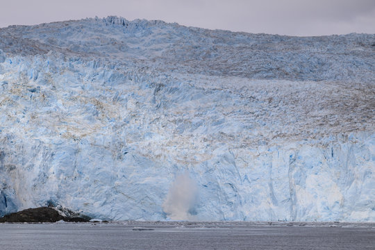 Aialik Glacier, glacial calving splash, blue ice, Harding Icefield, Kenai Fjords National Park, near Seward, Alaska