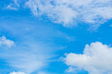 Blue sky background with tiny clouds. White fluffy clouds in the blue sky - 191330708