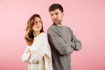Portrait of an upset couple dressed in sweaters