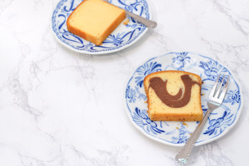 Slice of Marble cake on blue plate