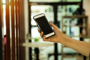 Themoblie phone was holding by human hand,