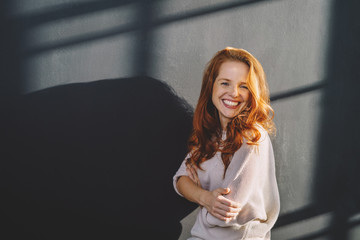 Friendly outgoing young redhead woman