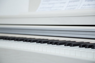 Close up of wooden white piano keys © Zoran