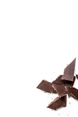dark chocolate pieces isolated on white background. Vertical composition. Top view