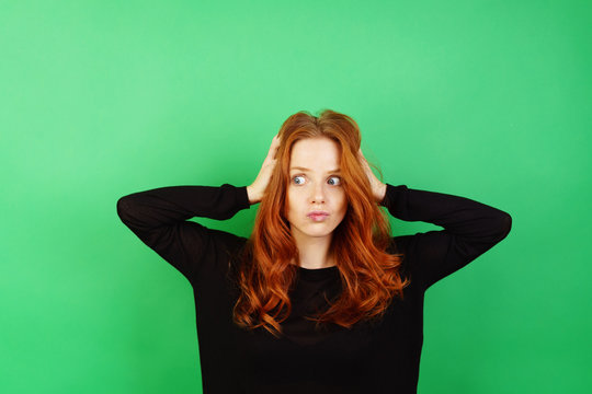 Confused neurotic young redhead woman